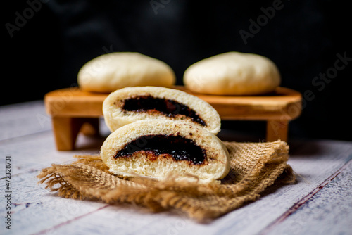 Bakpao, yeast-leavened filled bun in various Chinese cuisines, filling with chocolate photo