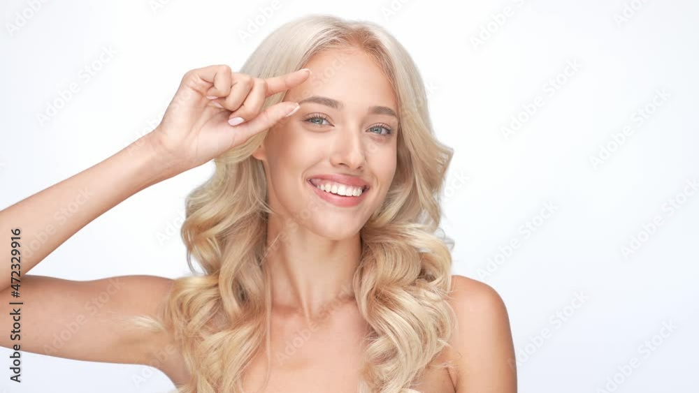 Lovely lady touch eye finger rejuvenate cream isolated white color background Lovely lady touch eye finger rejuvenate cream isolated white color background