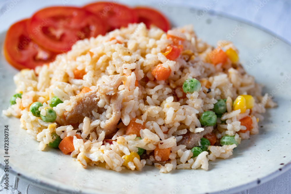 Fried rice with mixed vegetables and pork, top view Fried rice with mixed vegetables and pork, top view