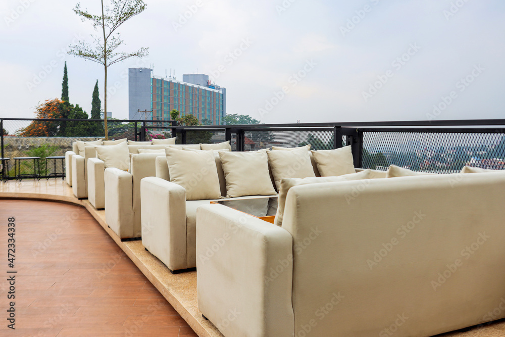 Cozy place to chilling. Row of couch or sofa at rooftop Cozy place to chilling. Row of couch or sofa at rooftop