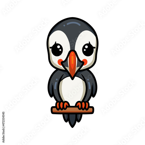 Cute little puffin bird cartoon on tree branch