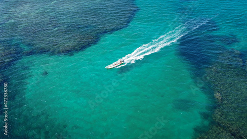 Boat in the ocean. Costa Rica´s beach. Travel - image. Boat on blue sea at sunny day.