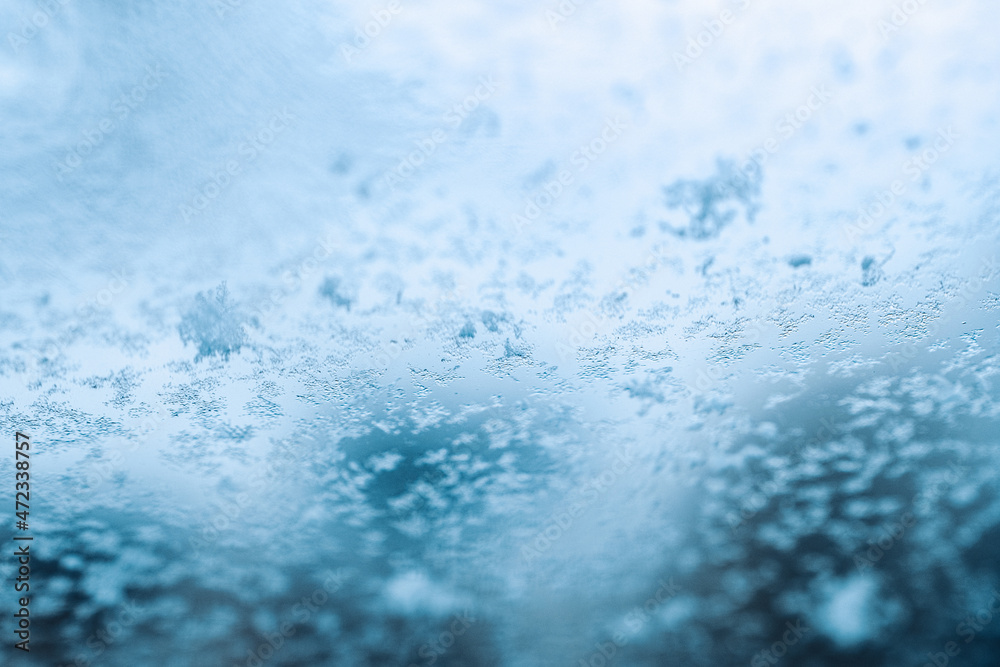 Obraz premium Frosting macro. Cold snow winter background. Blue crystal frozen abstract pattern. White frost ice texture.