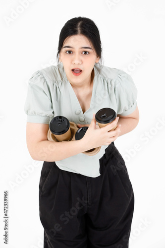 Obraz na plátne Portrait studio shot of Asian young clumsy teenager female model with ponytail h