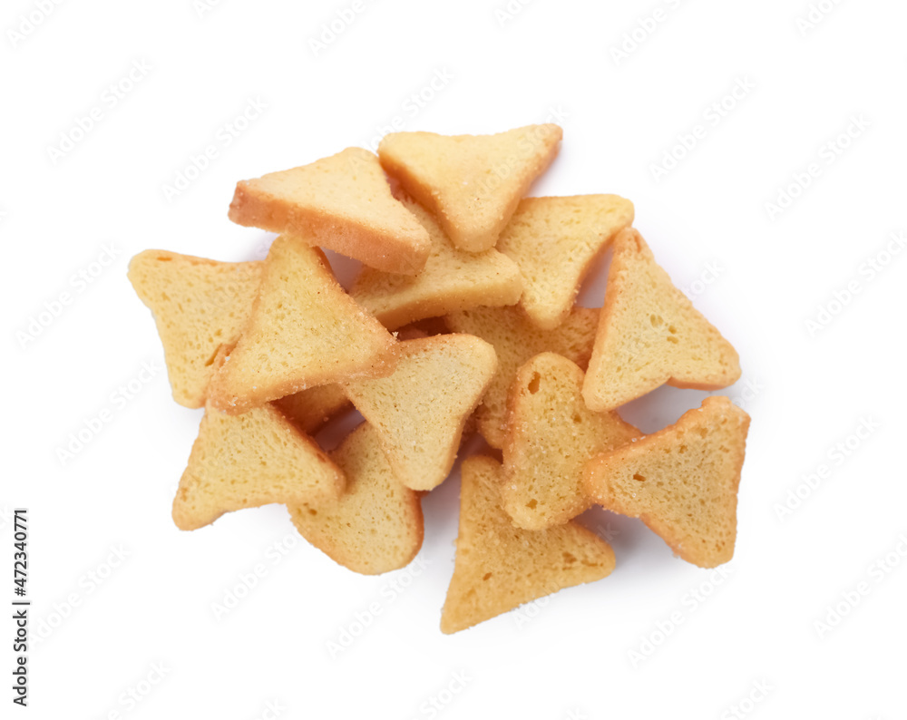 Pile of delicious crispy rusks on white background, top view Pile of delicious crispy rusks on white background, top view