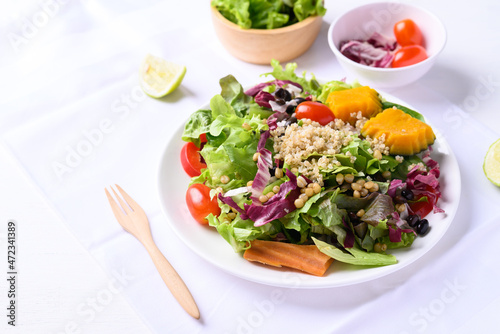Fresh organic vegetables with quinoa salad on white background ready to eating, Healthy Vegan food