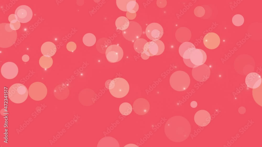 Falling big particles and round bokeh on red background, abstract cinematic and holiday style