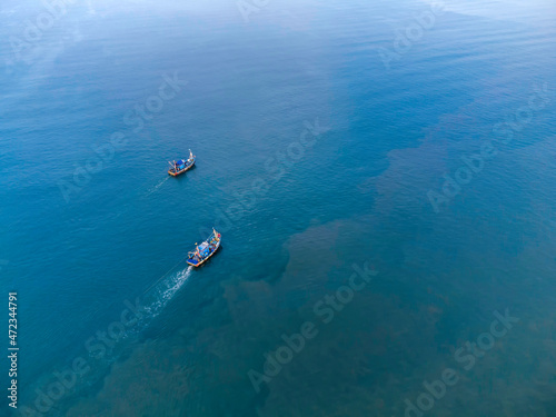 Aerial view of fishing boats off Betalbatim beach at South Goa, located on the West Coast of Maharashtra India. © dihuk