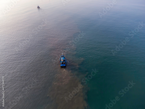 Aerial view of fishing boats off Betalbatim beach at South Goa, located on the West Coast of Maharashtra India.