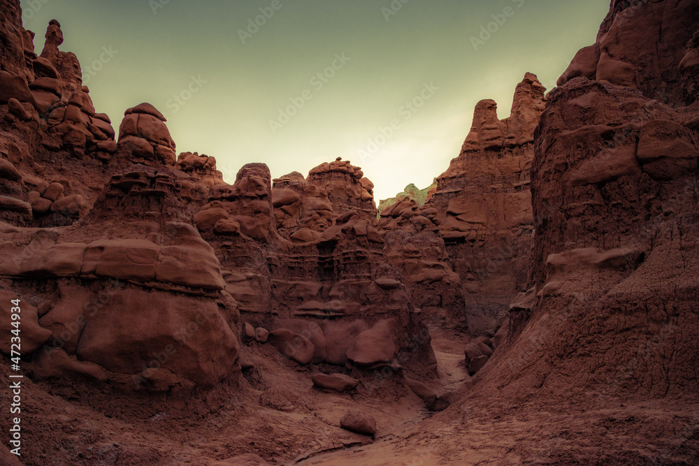 Fototapeta premium Lots of funny and whimsical figures of reddish-brown sandstone. Hoodoo - high thin geological formations. The Goblin Valley is a picturesque place in the famous Goblin Valley State Park. 
