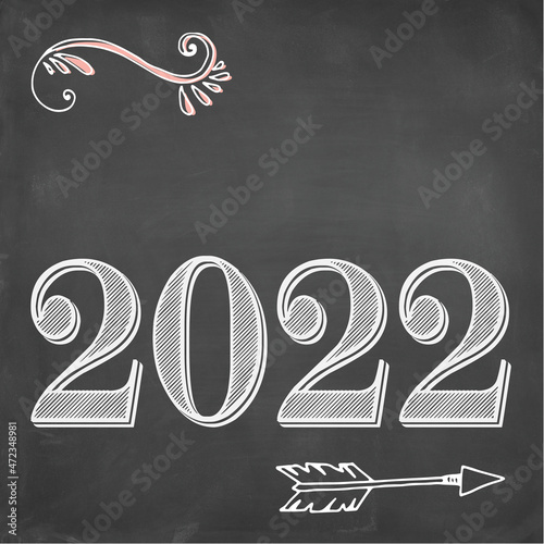 2022 sign. Hand drawn with white chalk and empty space to add text or logo on black board background