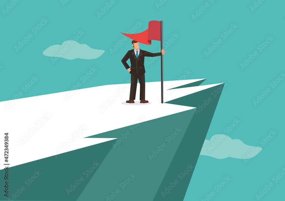 Businessman at the top of the mountain peak with a red flag