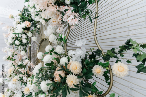 Metal construction with a large composition of flowers in it. the registration area on the wedding day. the concept of a holiday and celebration.