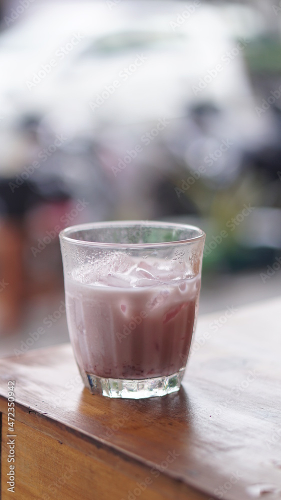 a glass of strawberry jam milkshake a glass of strawberry jam milkshake