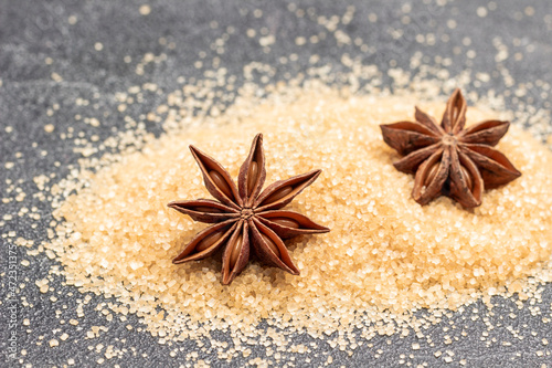 Dry star anise on brown sugar.