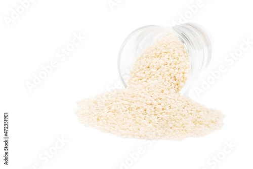 White sesame seeds organic on white background. Health food concept.