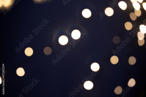 Blurred Christmas lights over dark blue background