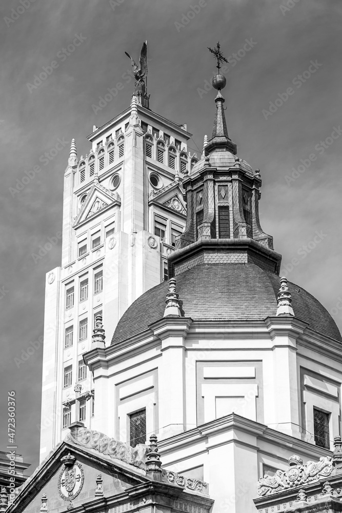 Dome of the Church of the Calatravas in the foreground and skyscrapers in the background. Madrid. Vertical view. Black and white.