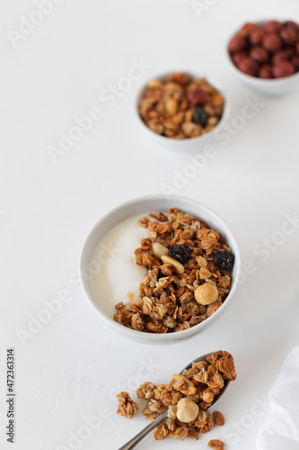 Homemade breakfast granola with nuts and raisins. Healthy food. Copy space. 