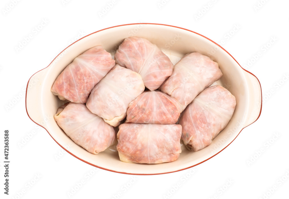 Stuffed cabbage rolls in baking dish isolated on white, top view