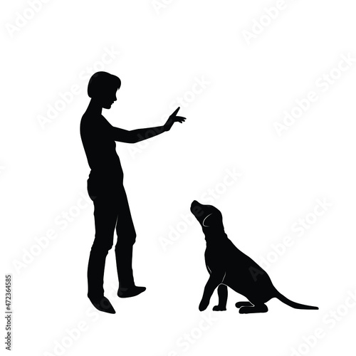 woman training a dog basic commands silhouette. Girl and pet puppy. Vector silhouette of a woman with a dog.