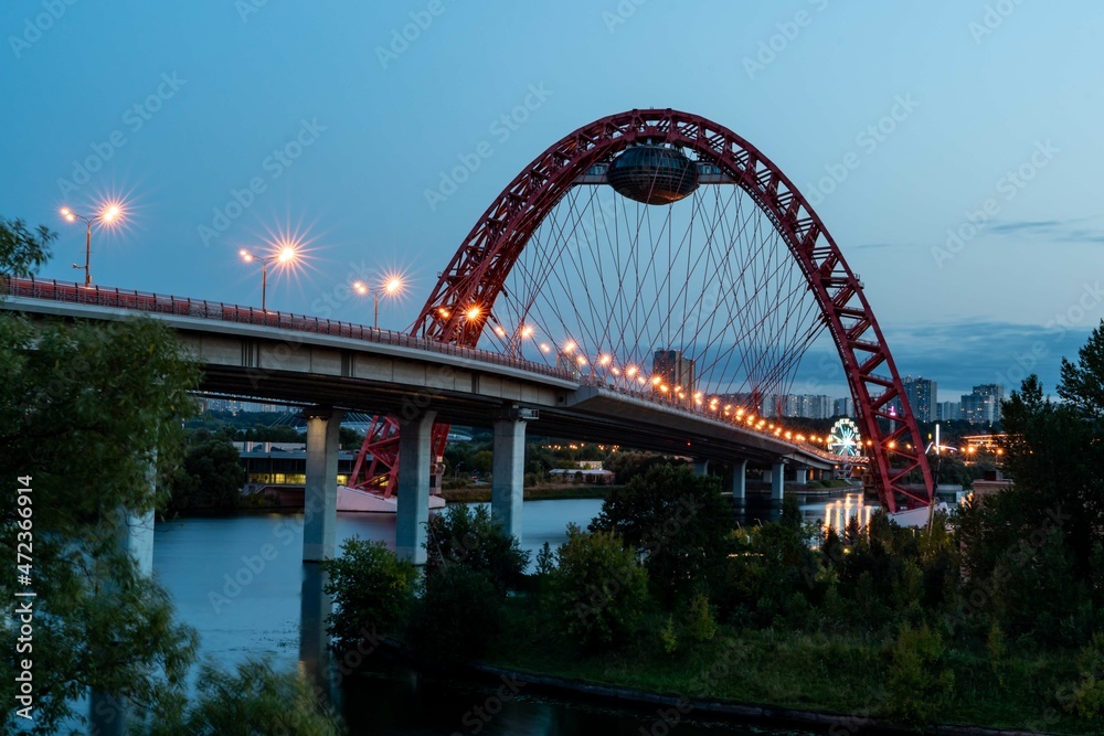 Beautiful bridge over the river in summer evening