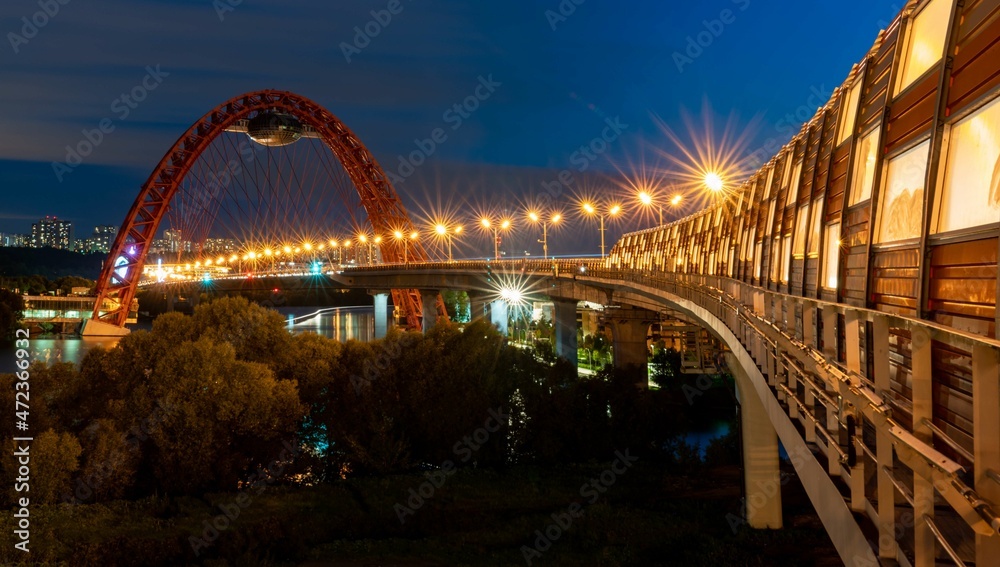 Fototapeta premium Beautiful bridge over the river in summer evening