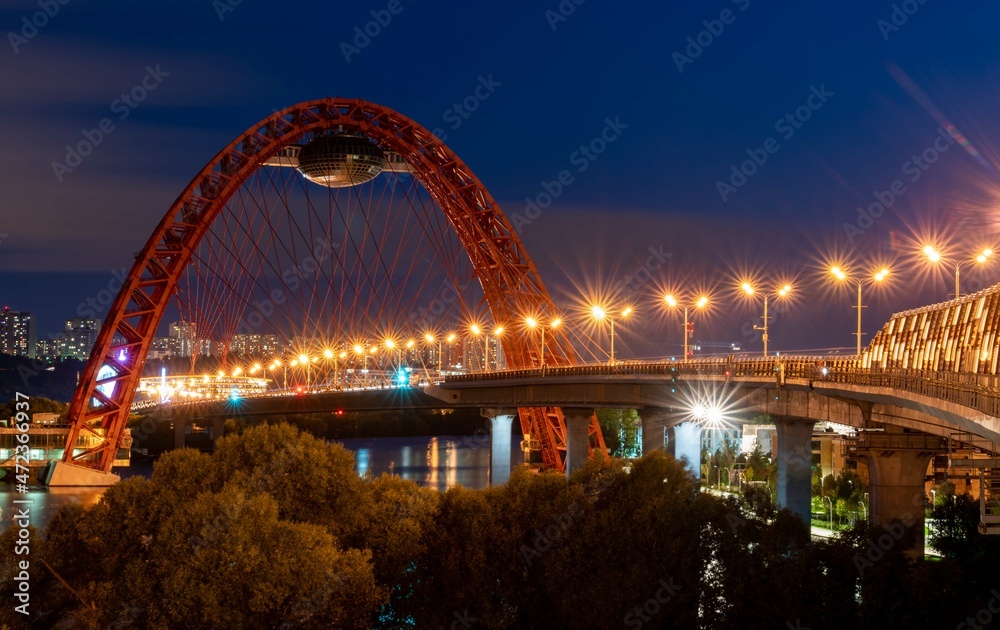 Fototapeta premium Beautiful bridge over the river in summer evening