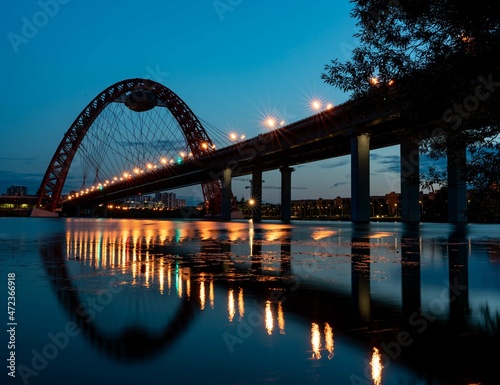 Fototapeta Naklejka Na Ścianę i Meble -  Beautiful bridge over the river in summer evening