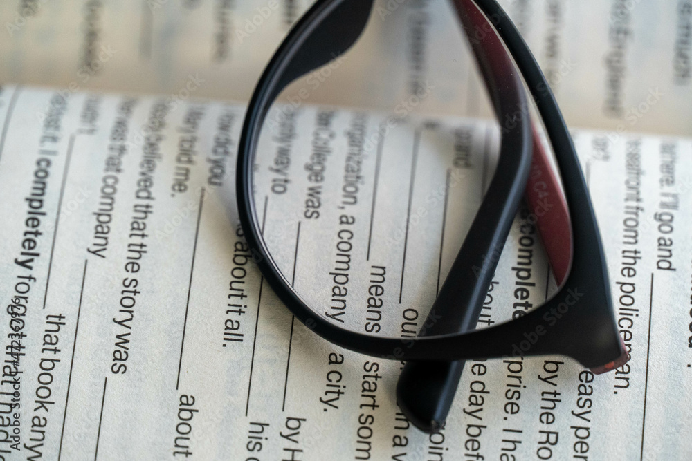 Glasses for vision lie on the book Glasses for vision lie on the book