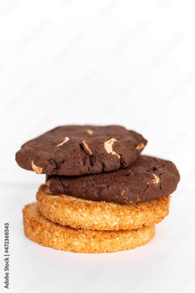 Coconut and chocolate cookies on a white background together