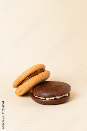 Close up Traditional chocolate and Pumpkin Whoopie pies. Background for bakeries, cafes, restaurants, copy space photo