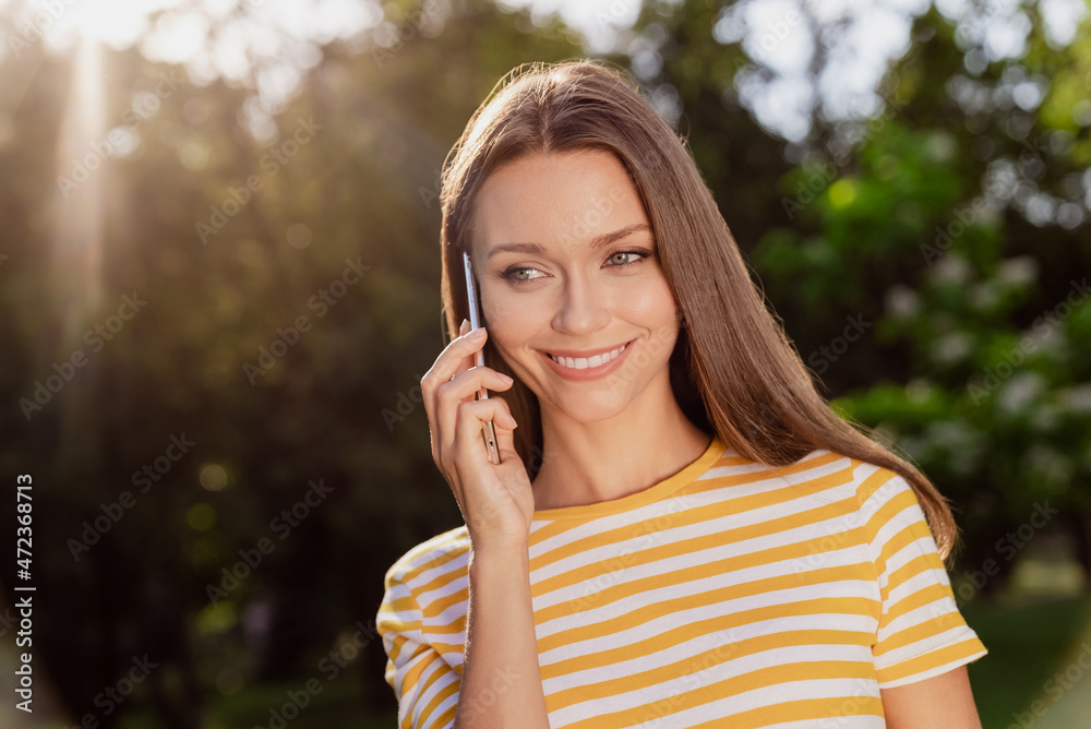 Portrait of attractive cheerful girl talking on phone contact discussing spending free time vacation sun shining bright outdoors Portrait of attractive cheerful girl talking on phone contact discussing spending free time vacation sun shining bright outdoors