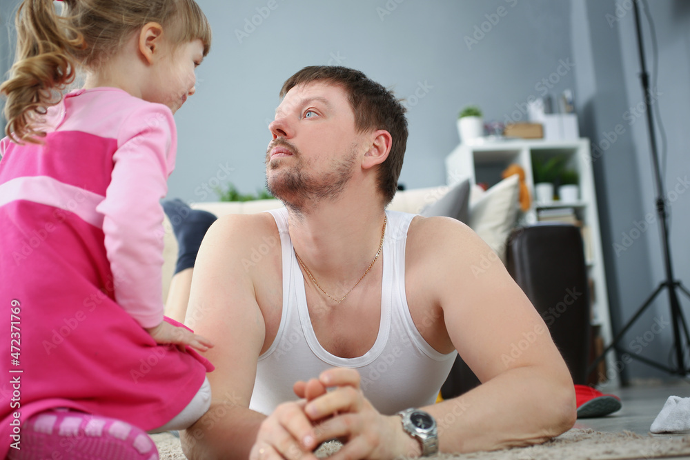 Father and daughter spending time together at home on holiday Father and daughter spending time together at home on holiday