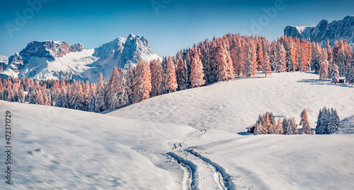 Panoramic morning view of Alpe di Siusi village. Incredible winter scene of Dolomite Alps. Spectacular landscape of ski resort, Ityaly, Europe. Beauty of nature concept background.