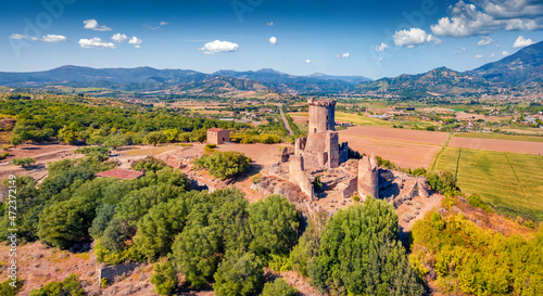 Fresh green summer view from flying drone of historical landmark - Velia Tower. Aerial morning scene of Parco Archeologico di Velia, Italy, Europe. Traveling concept background. photo