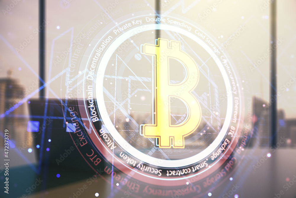 Double exposure of creative Bitcoin symbol hologram and modern desk with computer on background. Mining and blockchain concept Double exposure of creative Bitcoin symbol hologram and modern desk with computer on background. Mining and blockchain concept