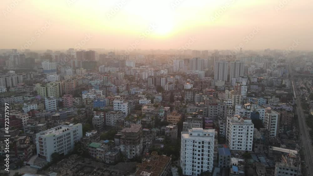 Yellow Haze Sunset Over Dense Dhaka Metropolitan Cityscape. Aerial Dolly Left Yellow Haze Sunset Over Dense Dhaka Metropolitan Cityscape. Aerial Dolly Left