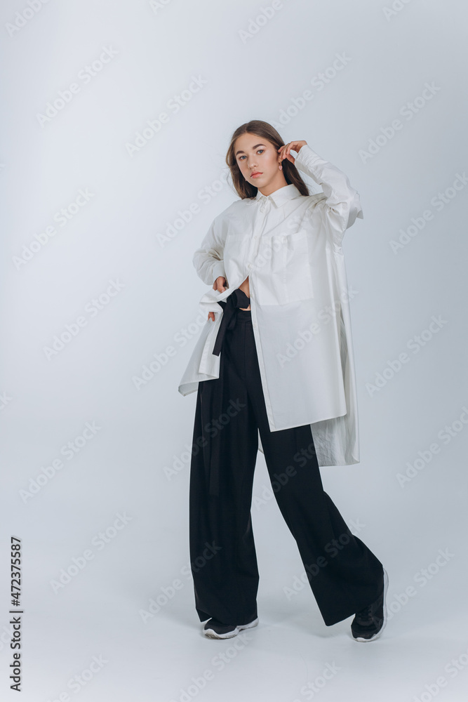 Young caucasian pretty woman portrait. Blondie long haired girl on white isolated background in studio Young caucasian pretty woman portrait. Blondie long haired girl on white isolated background in studio