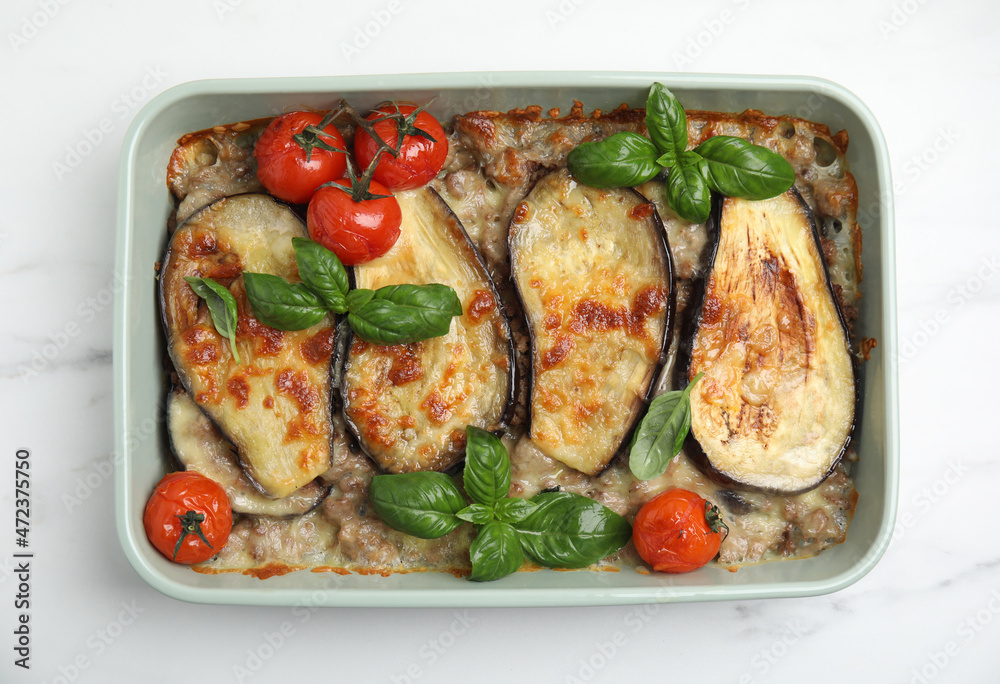 Delicious eggplant lasagna in baking dish on white marble table, top view Delicious eggplant lasagna in baking dish on white marble table, top view