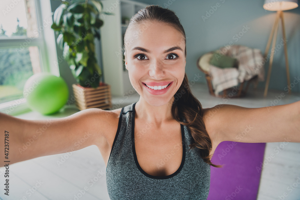 Self-portrait of attractive cheerful thin healthy girl doing physical work out staying safe at home studio indoors Self-portrait of attractive cheerful thin healthy girl doing physical work out staying safe at home studio indoors