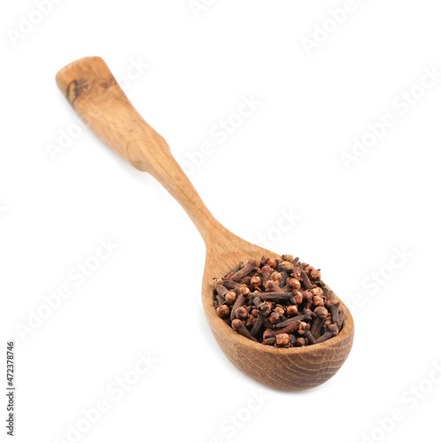 Wooden spoon with aromatic dry cloves isolated on white