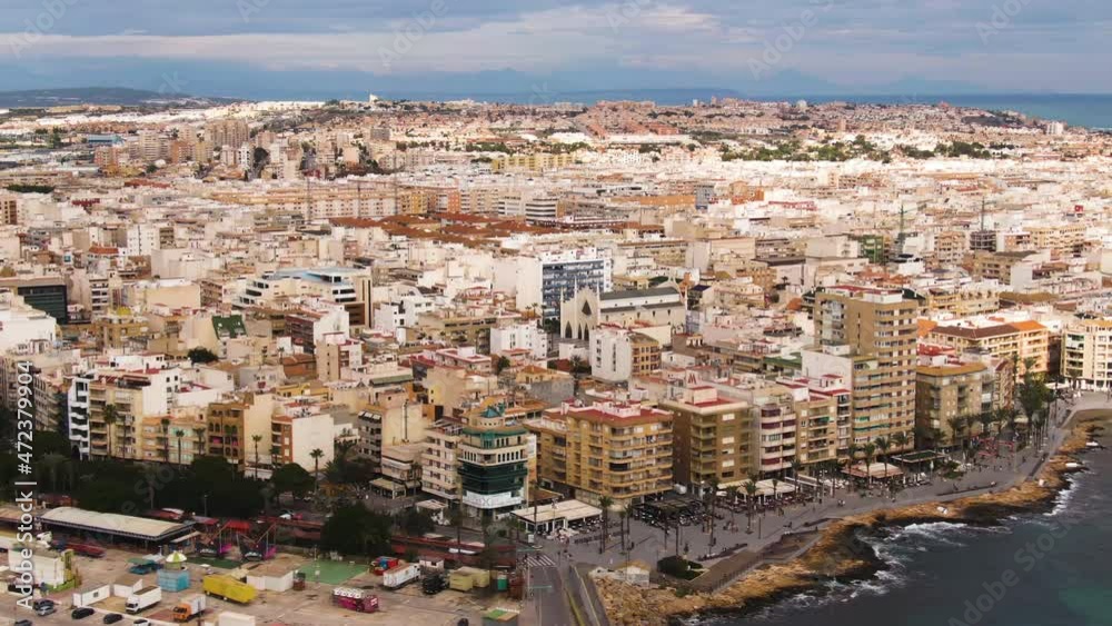 Vast cityscape of Torrevieja on sea coastline, aerial high angle view Vast cityscape of Torrevieja on sea coastline, aerial high angle view