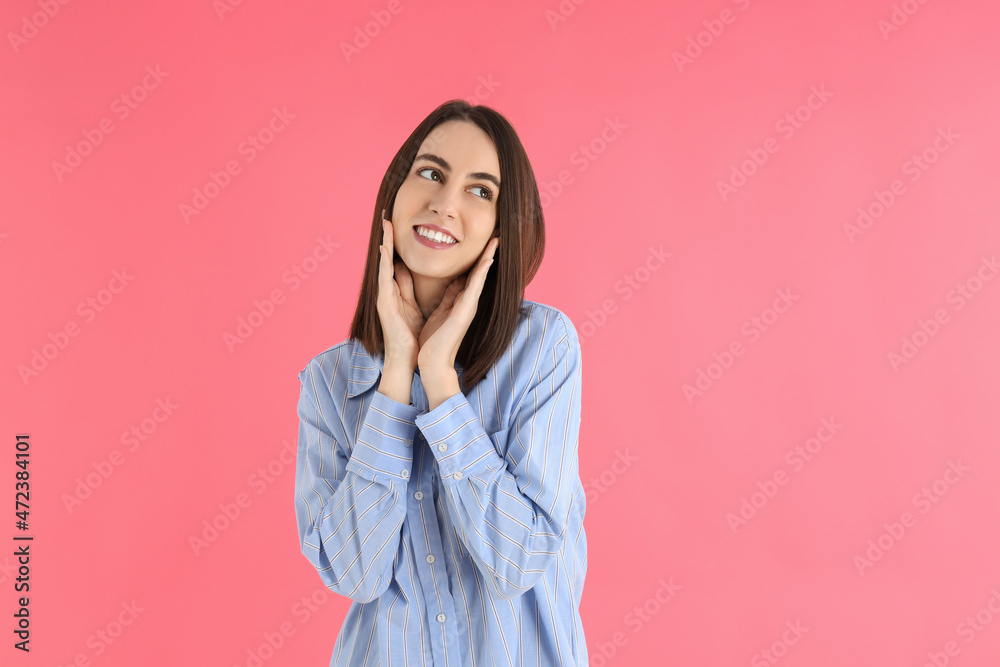 Young attractive woman in shirt on pink background Young attractive woman in shirt on pink background