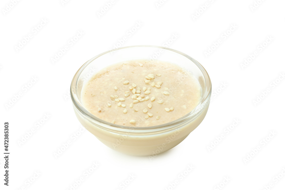 Tahini sauce in bowl isolated on white background Tahini sauce in bowl isolated on white background