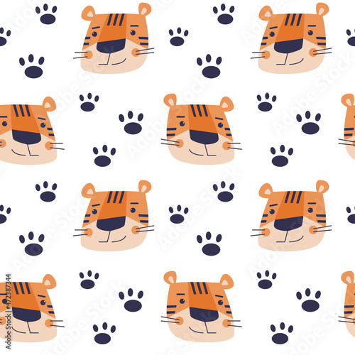 Vector seamless pattern with cartoon tigers muzzles and paws.