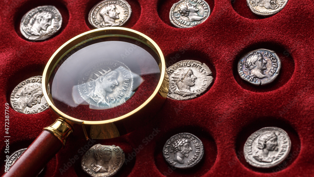 Numismatics.Authentic silver denarius, antoninianus of ancient Rome. A collector holds an old coin.Ancient coin of the Roman Empire Numismatics.Authentic silver denarius, antoninianus of ancient Rome. A collector holds an old coin.Ancient coin of the Roman Empire