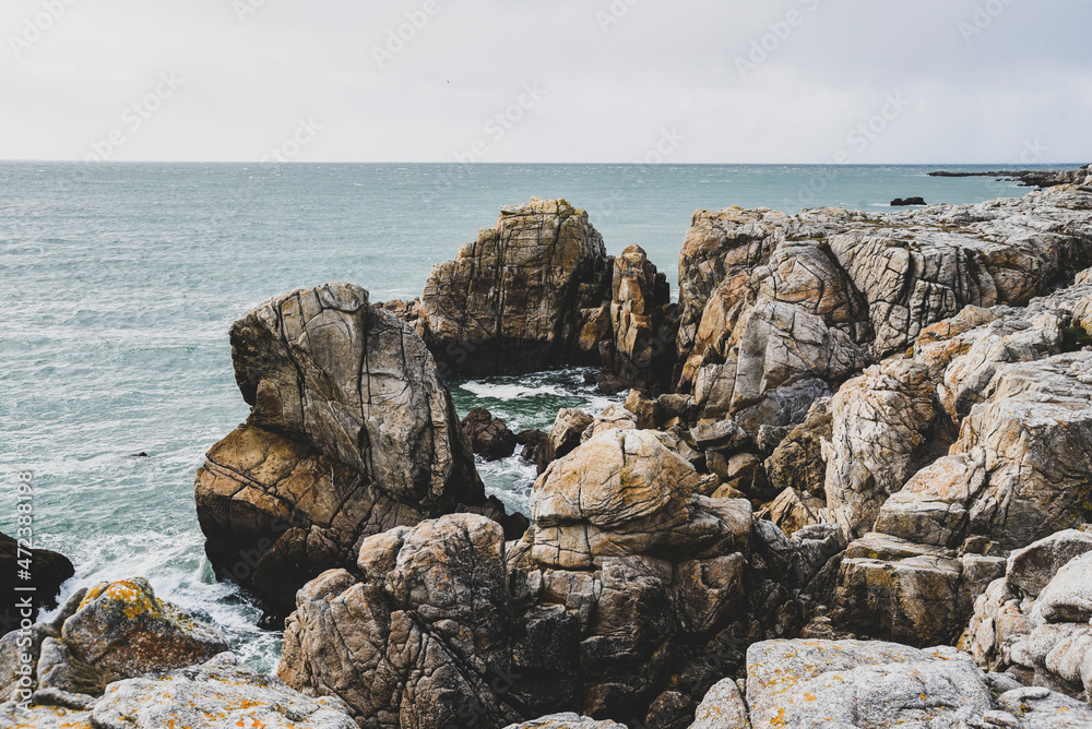 Beautiful and wild rocky coast of France in vintage retro tones, vintage landscape of coastline of France.