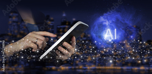 Artificial intelligence industry 4.0. Hand touch white tablet with digital hologram Artificial intelligence sign on city dark blurred background. AI, Machine learning