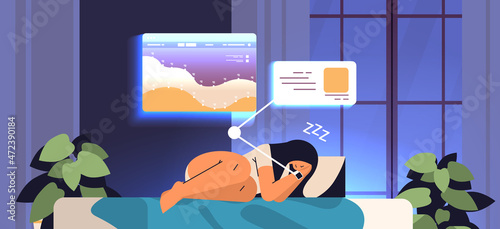 young woman sleeping in bed with electronic smart watch app tracker on hand quality and quantity sleep control